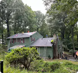 Boundless New Jersey Roofing Contractors performing roof repair on a residential home.