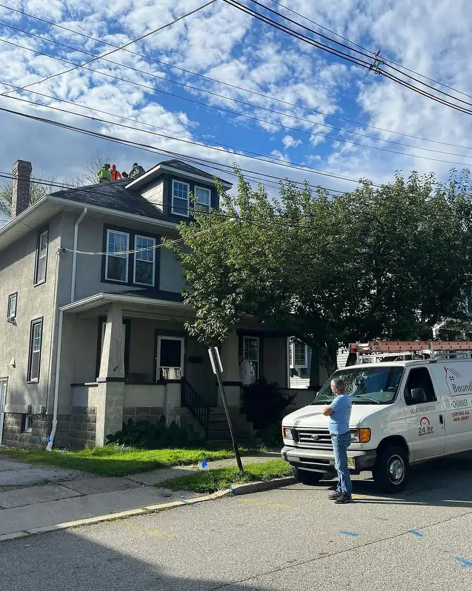 Boundless New Jersey Roofing Contractors working on a residential roof repair.